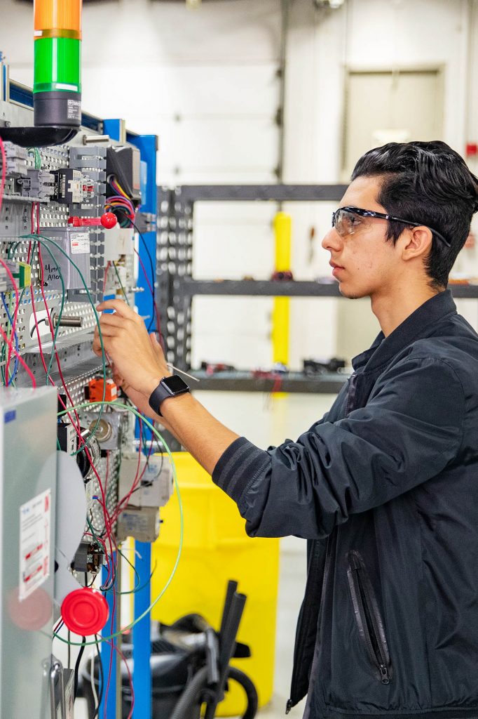 Student learning ElectroMechanical Systems at Central Tech