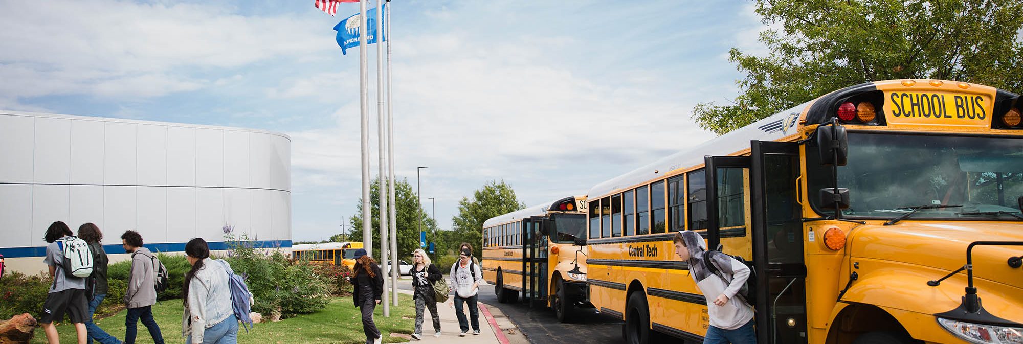 Students getting off the bus at Central Tech in Drumright