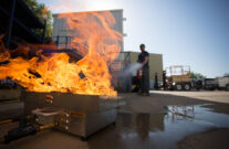 firefighter putting out training fire