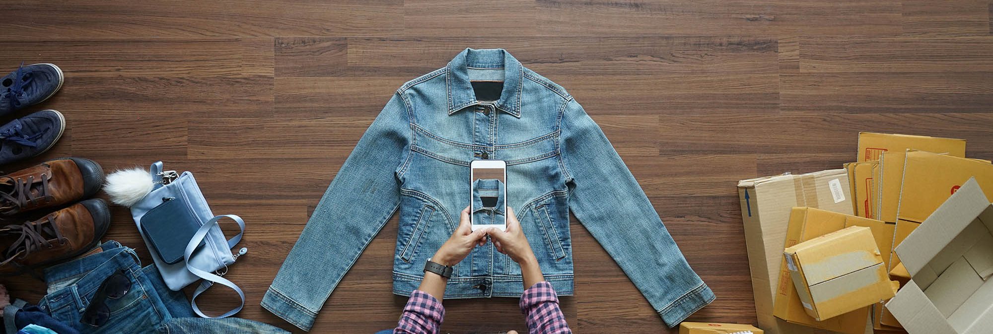 photo of a woman taking a picture of her products to sell