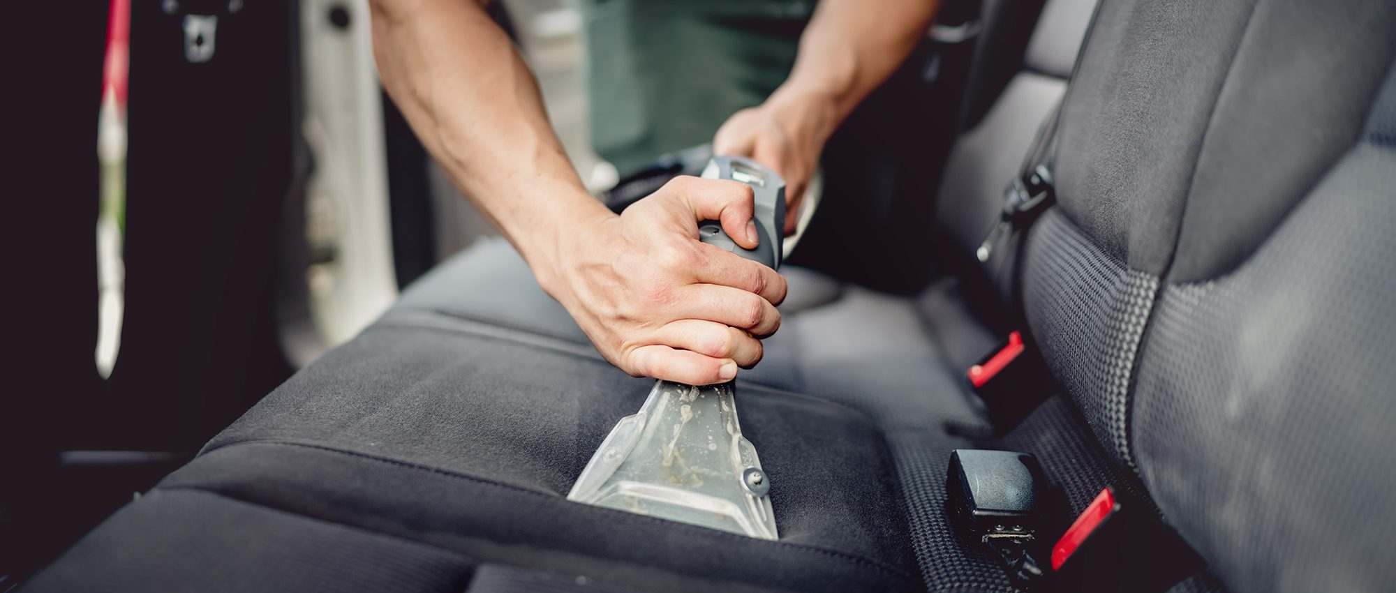 picture of man detailing a car