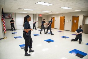 practicing handcuffing at Central Techs Criminal Justice class