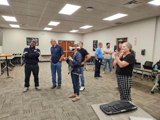 Our Workforce & Economic Development (WED) team has partnered with Ardagh, offering VR training in their IS Operator Apprenticeship courses.

In these photos, trainers and operators are demonstrating the technical skills needed to reach Journeyman‑level operator status. Using digital twins of Hot End equipment from the bottle‑making process, this VR setup creates a safe, controlled space where skills can be taught and practiced.

@ardaghgroup
