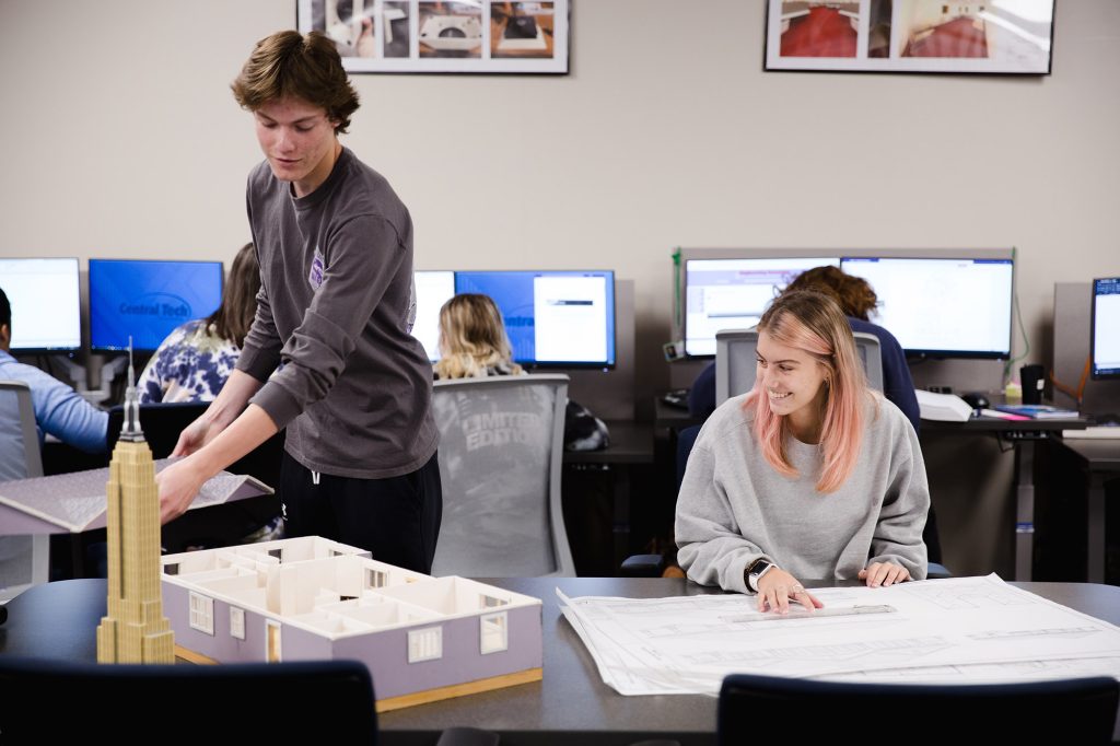 two CAD students at Central Tech reviewing blueprints